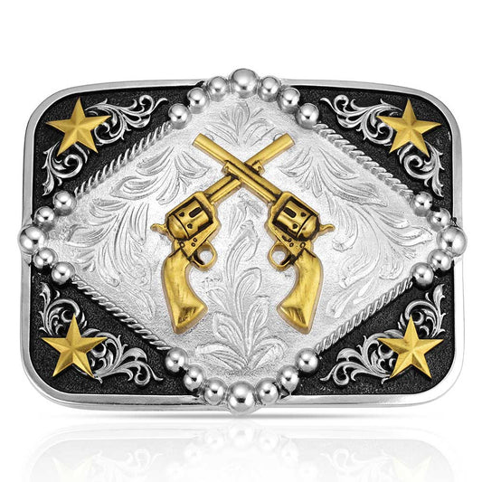 Montana Silversmiths Belt buckle with gold revolvers, stars, and decorative patterns on a black background