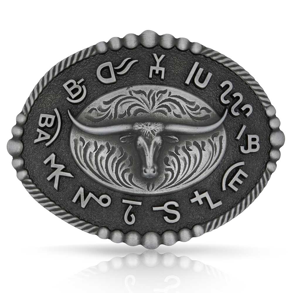 Metallic Montana Silversmiths belt buckle with bull design and engraved text on a white background