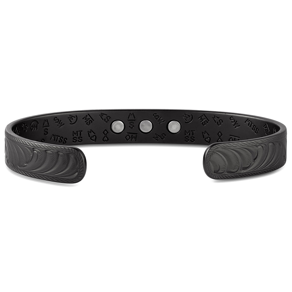 Black Montana Silvesmiths bracelet with engraved patterns on a white background