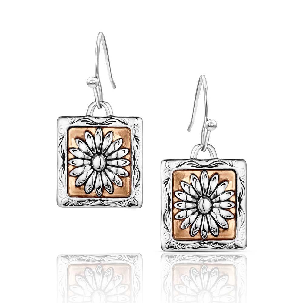 Pair of Montana Silversmiths earrings with square design featuring floral patterns on a white background