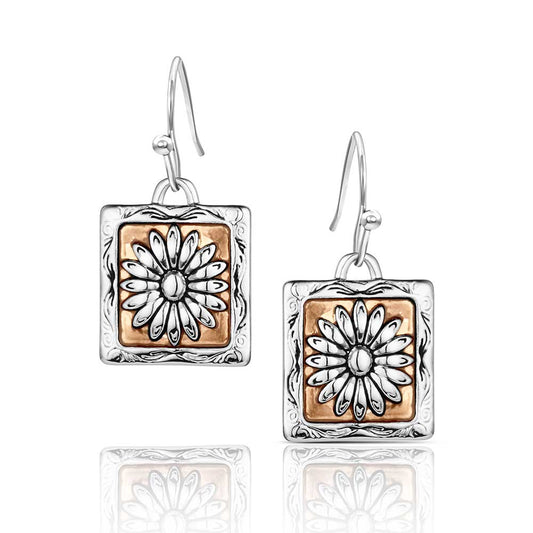 Pair of Montana Silversmiths earrings with square design featuring floral patterns on a white background
