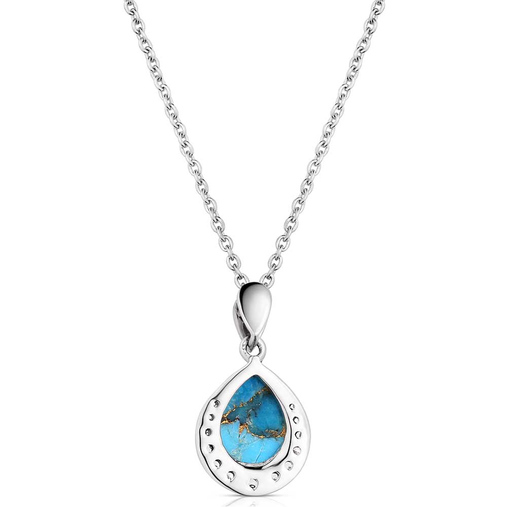 Silver Montana Silversmiths necklace with a turquoise stone on a white background