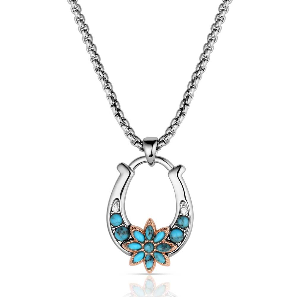 Montana Silversmiths Necklace with a horseshoe pendant featuring turquoise stones on a white background