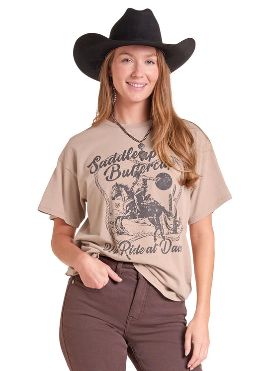 Woman wearing a taupe colored tshirt from Rock&Roll Denim, brown jeans and a black cowboy hat on a white background