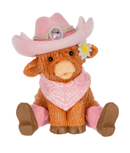 a small cow figurine from Ganz wearing western wear on a white background