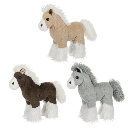 Three stuffed horses from Ganz on a white background