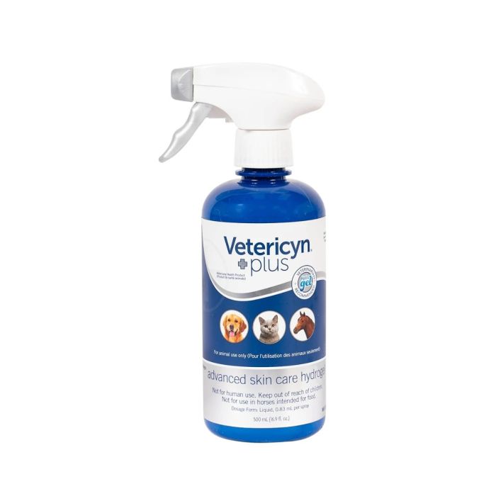a blue spray bottle with vetericyn plus advanced skin care hydrogel with dog, cat and horse on the label