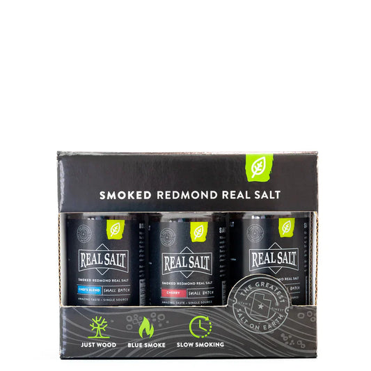 A box of Redmond Real Salt Smoked Real Salt Shaker Set with three shaker bottles visible in the compartments.
