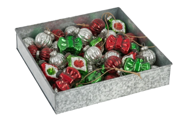 a metal tin from Ganz with holiday ornaments in it on a white background