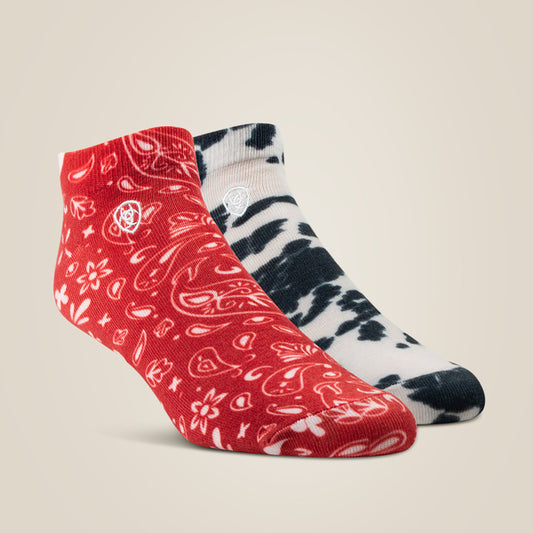 Two Ariat socks, one red with bandana pattern and one black and white striped, on a beige background.