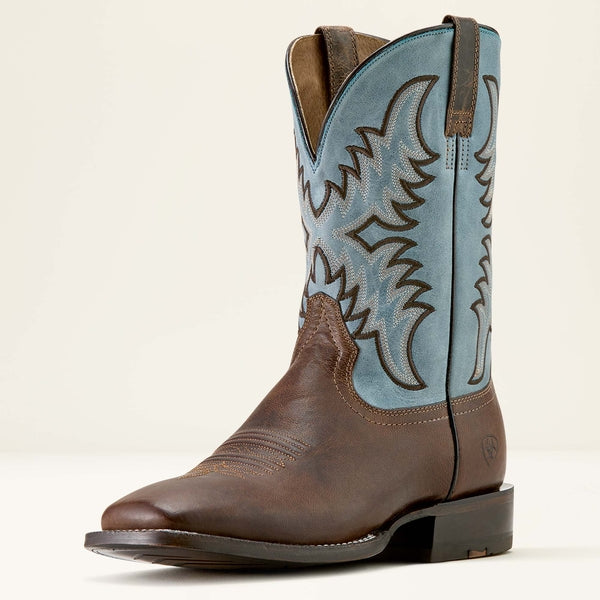 Brown Ariat cowboy boot with blue on a white background