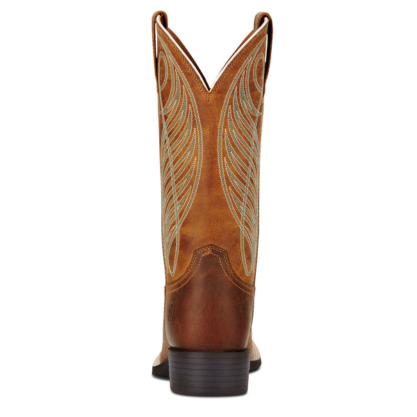 Brown Ariat cowboy boot with intricate white stitching on a white background