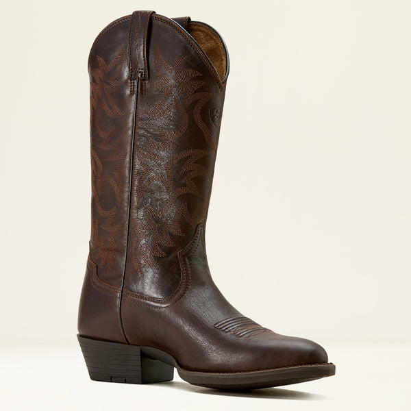 Brown leather Ariat cowboy boot on a cream background