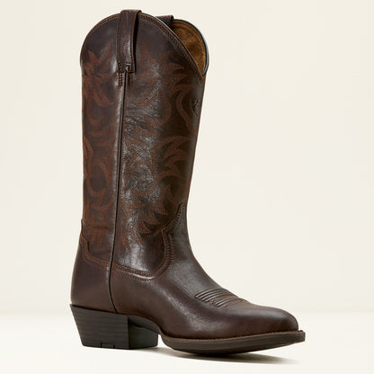 Brown leather Ariat cowboy boot on a cream background