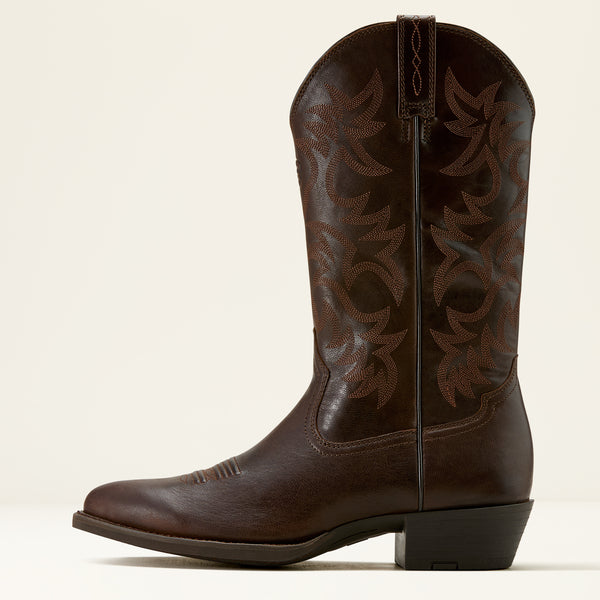Brown leather Ariat cowboy boot on a cream background