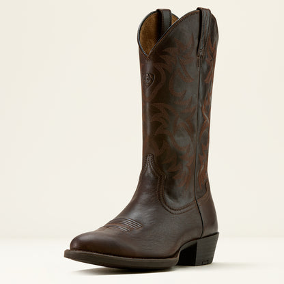 Brown leather Ariat cowboy boot on a cream background