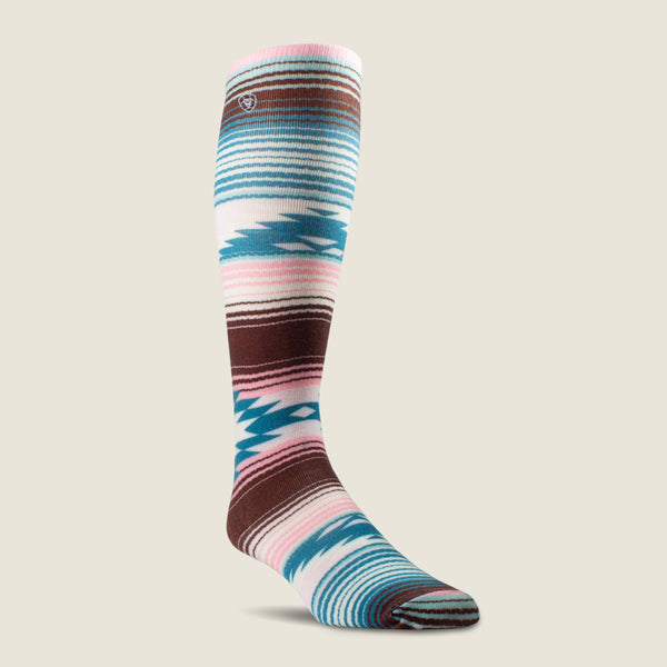 A single knee-high Ariat sock with a Southwestern geometric pattern in brown, teal, pink, and white, shown on a light beige background.