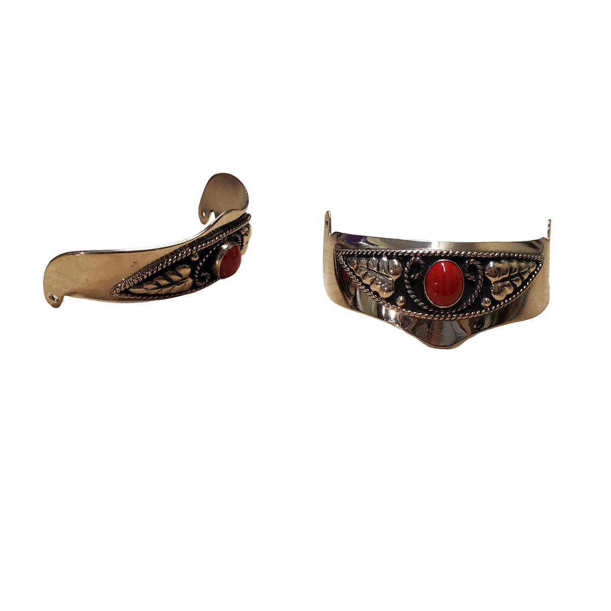 a pair of silver heel caps with red stones on a white background
