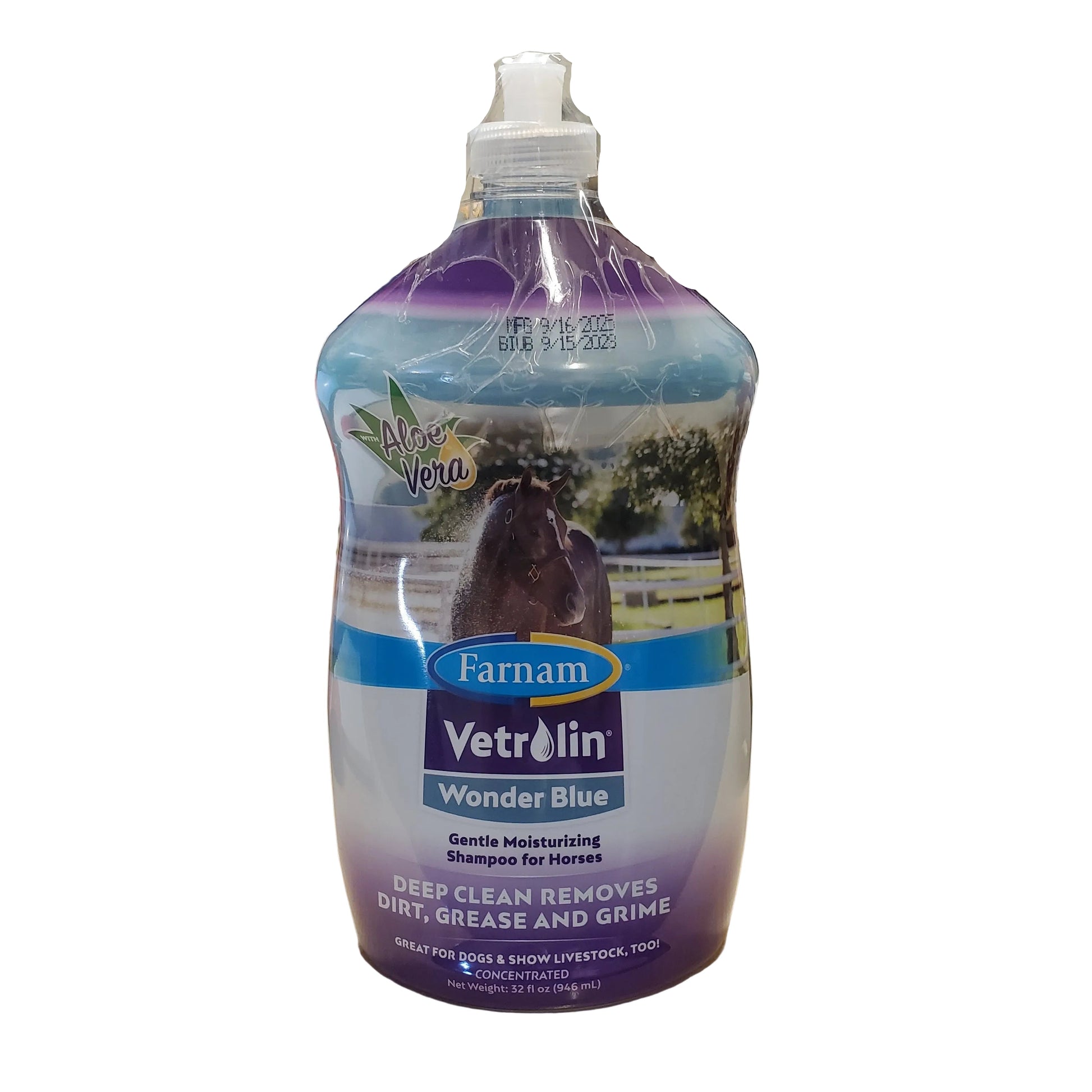 Bottle of Farnam Vetri-All Wonder Blue shampoo on a counter with a coffee cup and other items in the background.