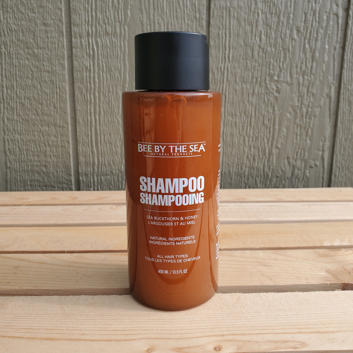 a 400 ml brown bottle of bee by the sea shampoo 