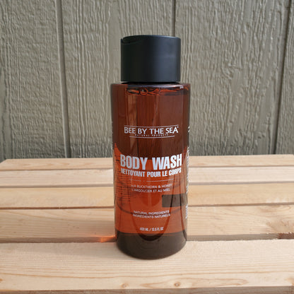 a 400 ml brown bottle of bee by the sea body wash