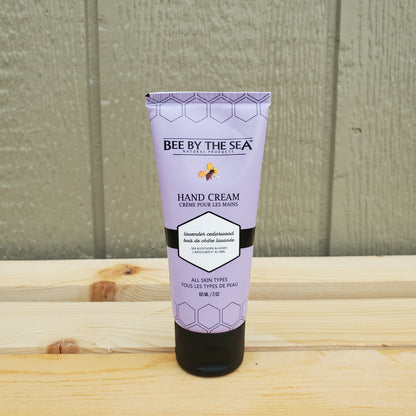 Tube of Bee by the Sea hand cream on a wooden surface