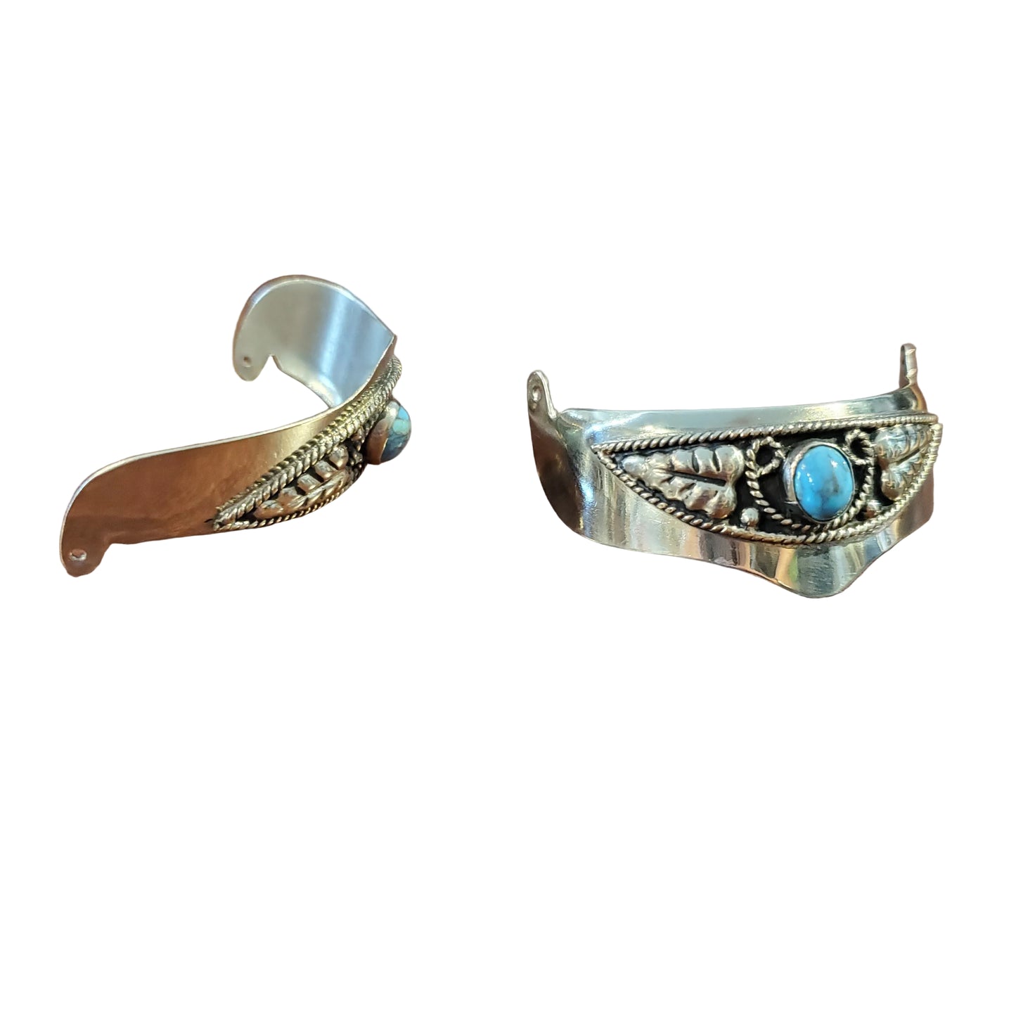 A pair of vintage silver-toned handcrafted earrings with turquoise stones.
