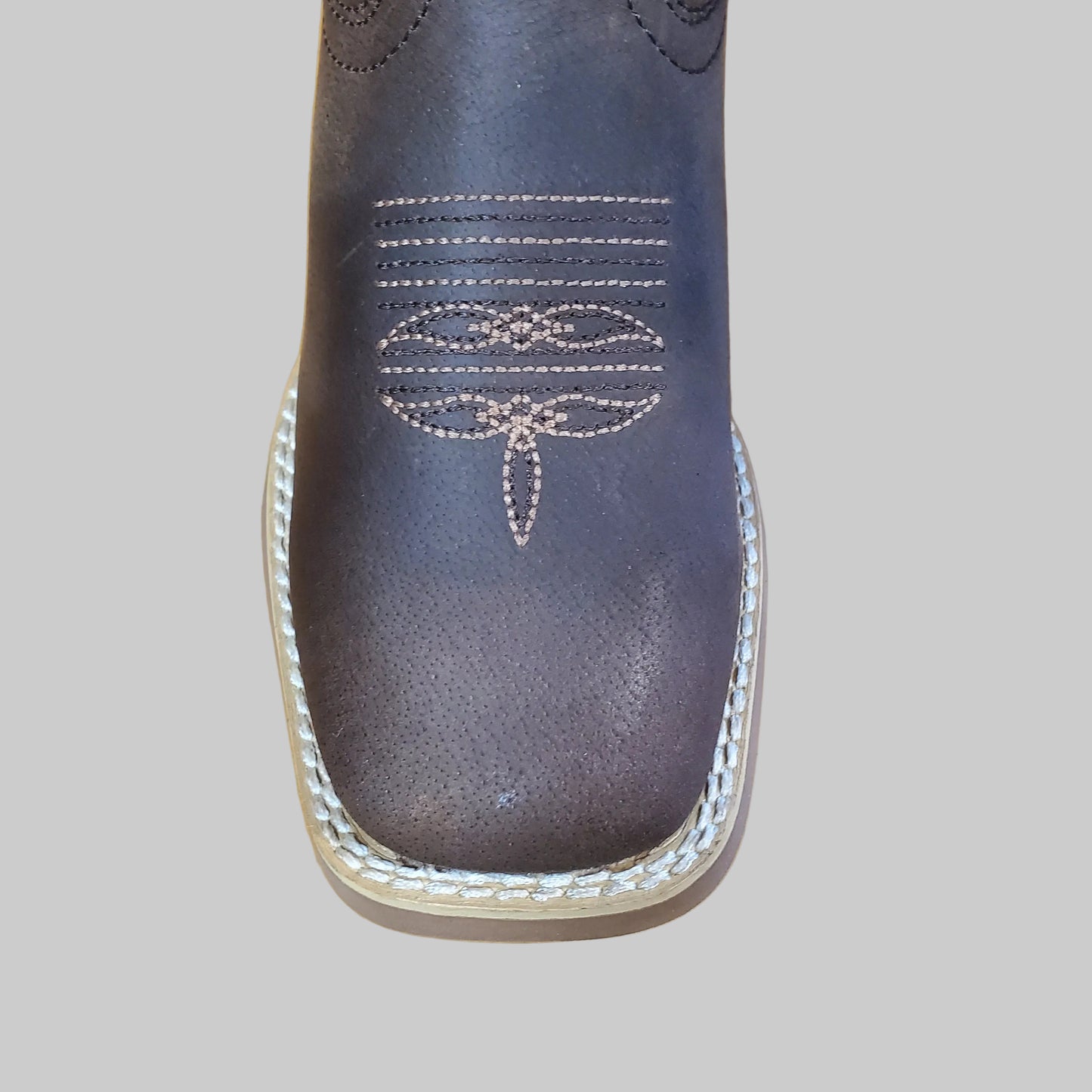 Close up of Durango boot toe on a white background