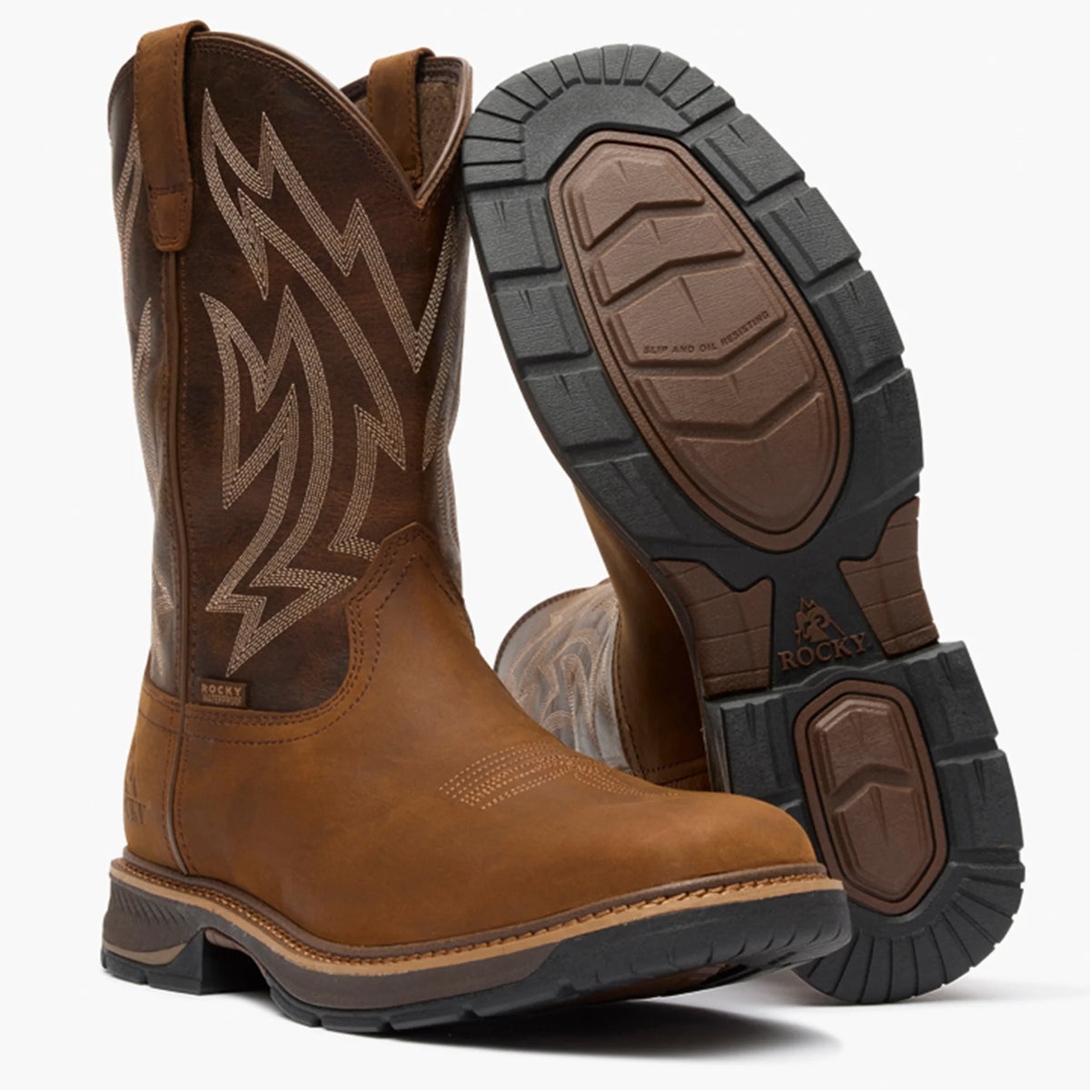 Brown Rocky work boots with black soles on a white background
