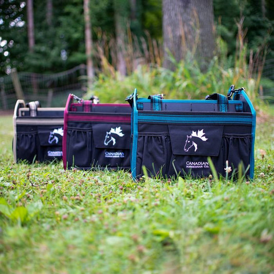 3 grooming totes by canadian horsewear co in an outdoor setting