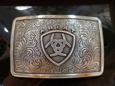 Rectangle belt buckle with ariat logo with black background