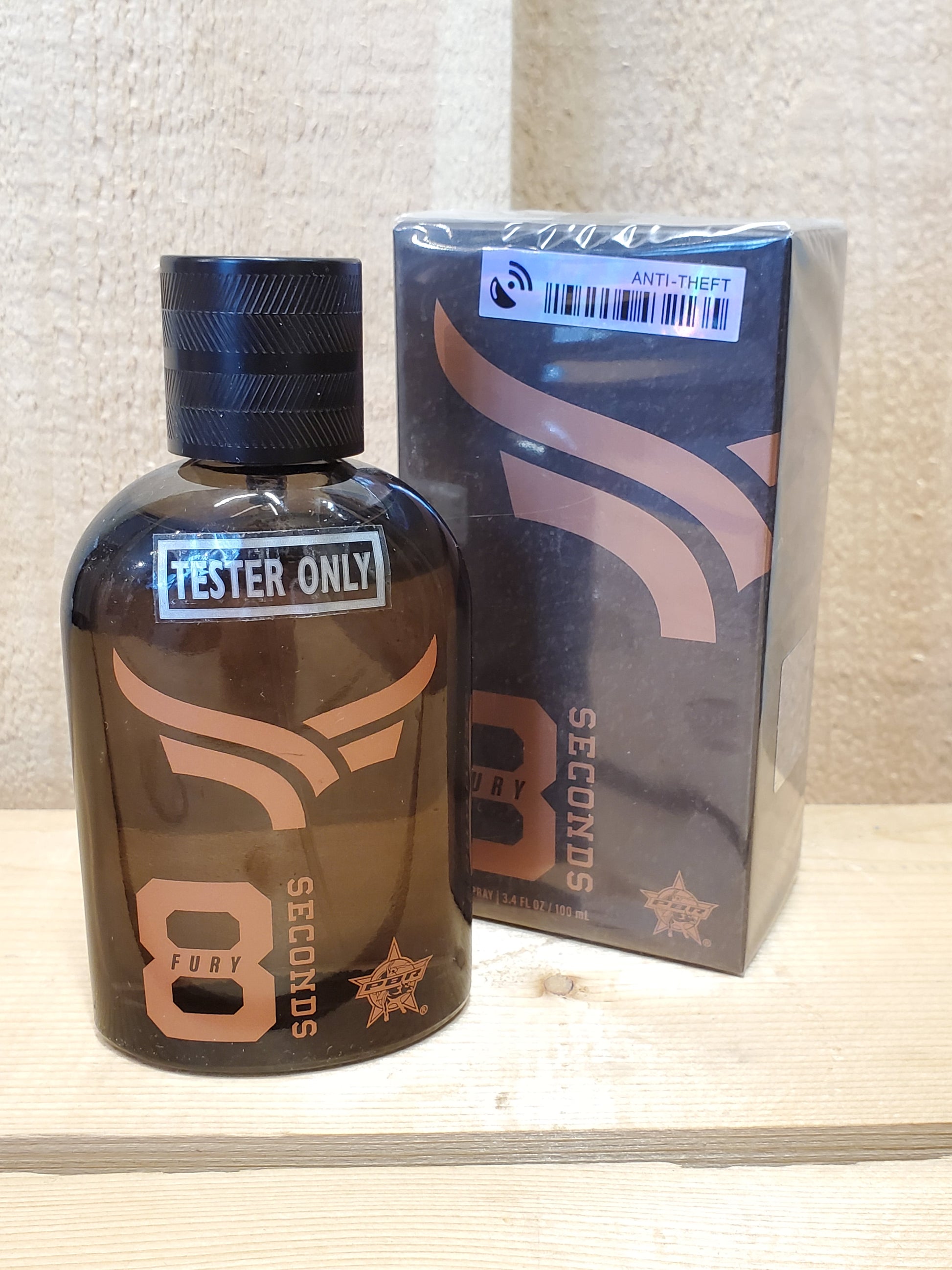 A bottle of '8 Seconds-Fury' Men's Cologne with its packaging box. The bottle is dark glass with a label that includes the product name and a star symbol.