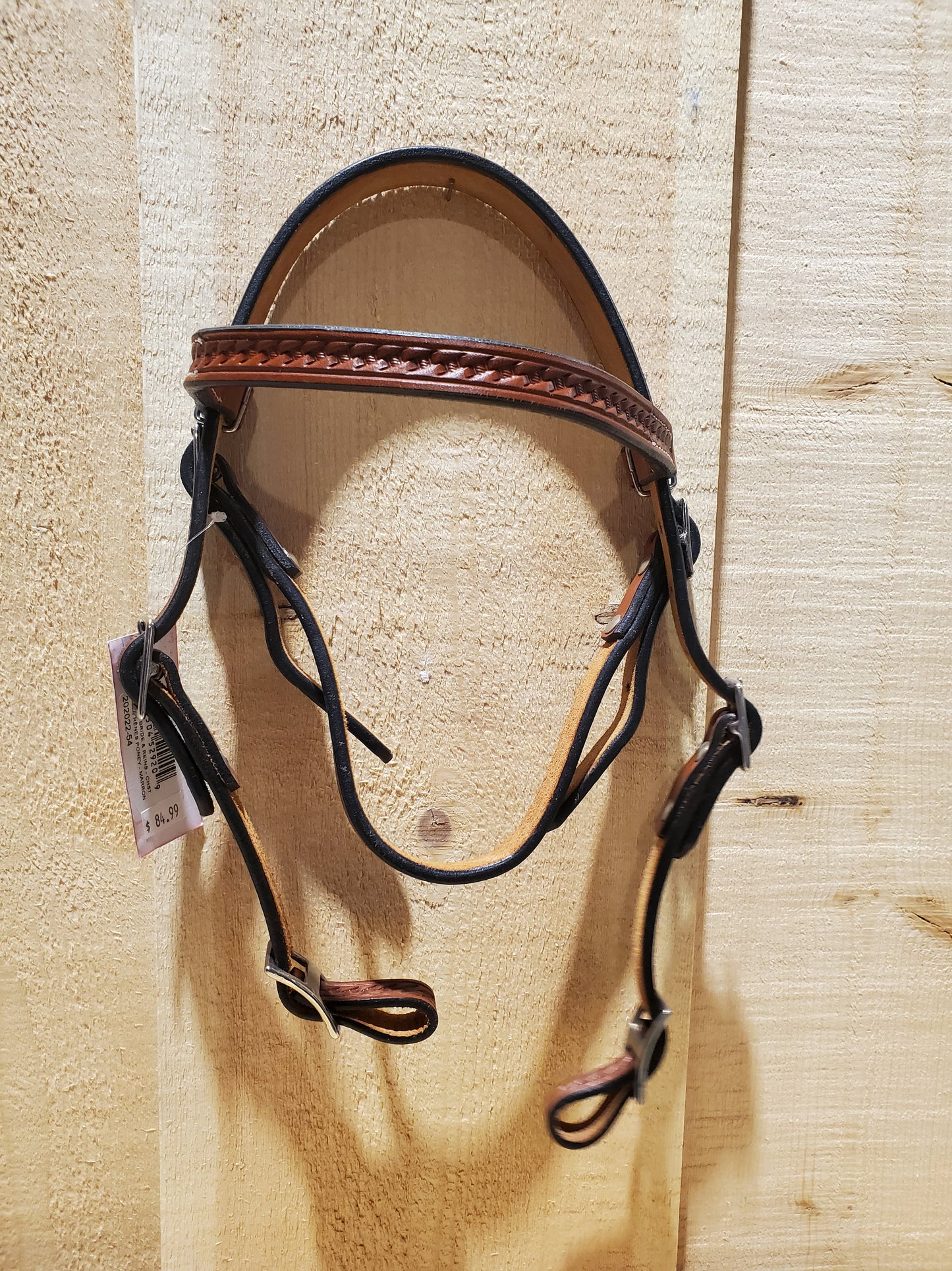 a leather bridle on a wooden background