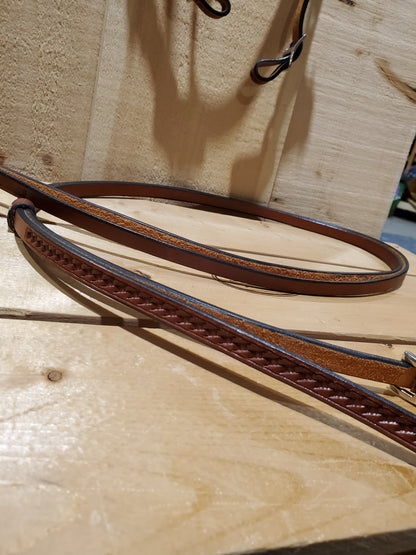leather reins on a wooden background