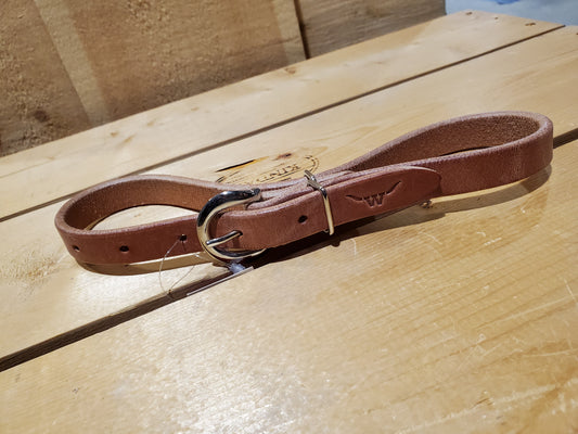 leather strap with a double bar roller buckle and a metal loop used as a breast collar tug for horse equipment