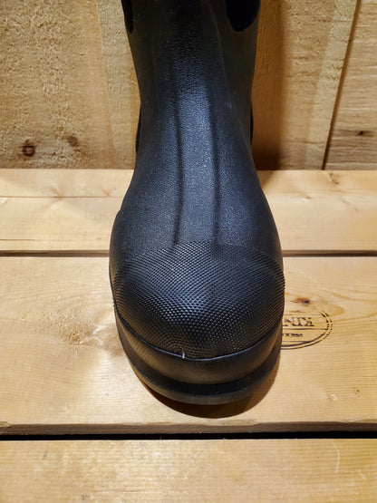 a close up of a toe of a black rubber boot
