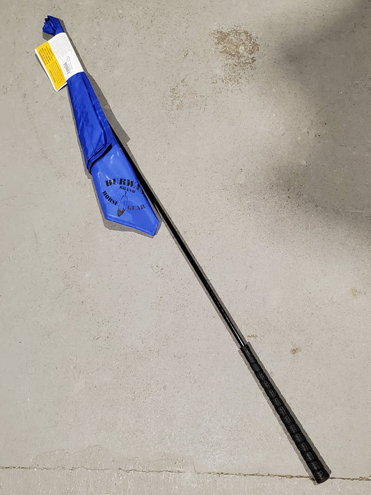 a blue flag on the end of a black stick on a cement background