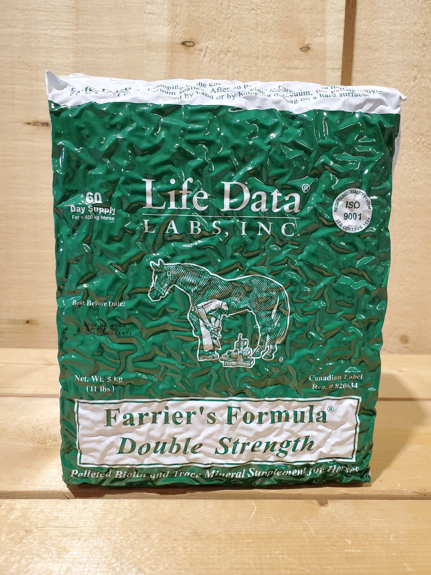 A green bag of Farrier's Formula Double Strength horse feed by Life Data Labs, Inc., with a graphic of a horse on the front.