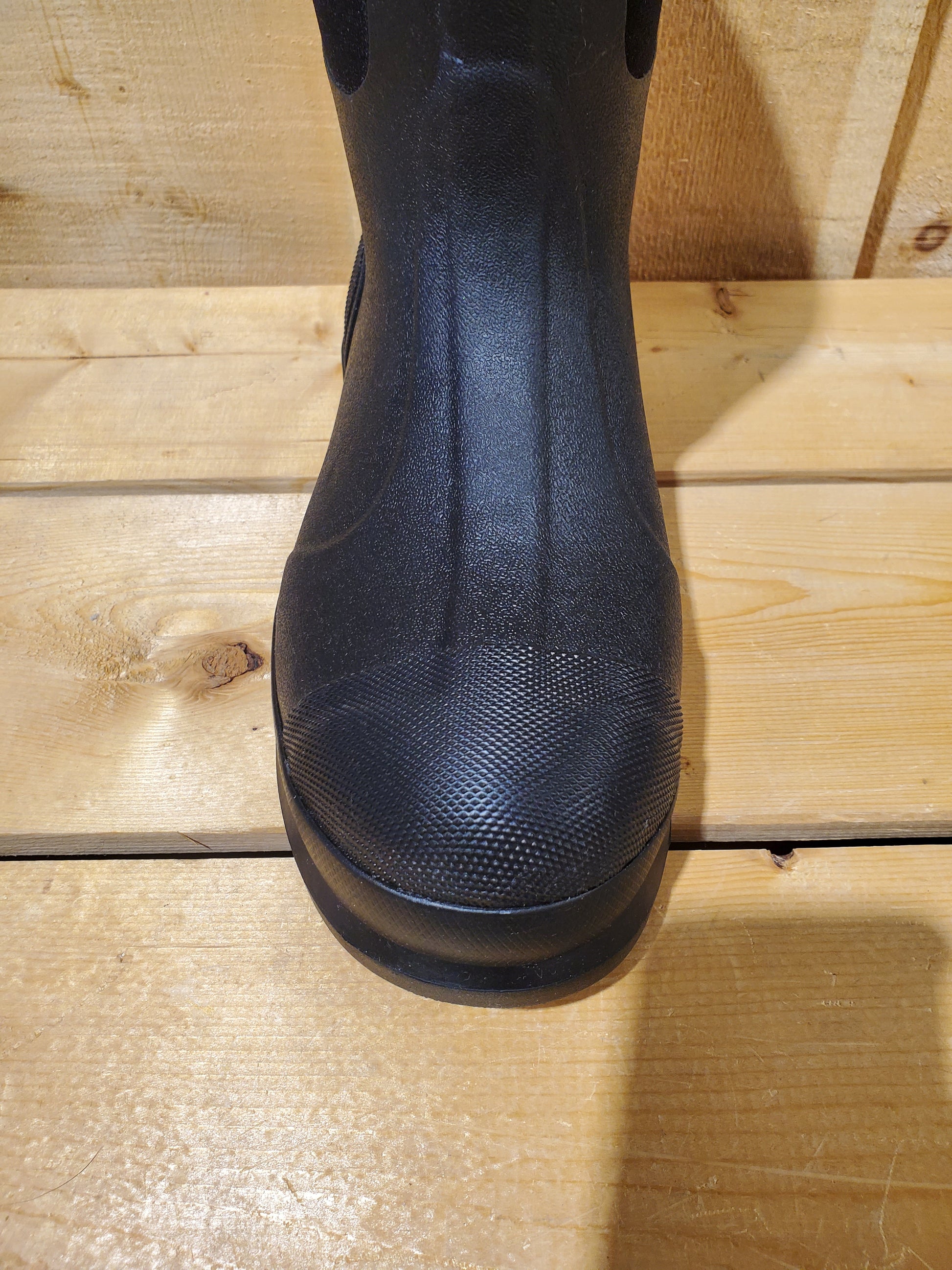 close up of the toe of a rubber boot