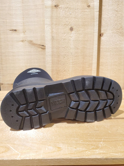 the outsole of a rubber boot on a wooden background