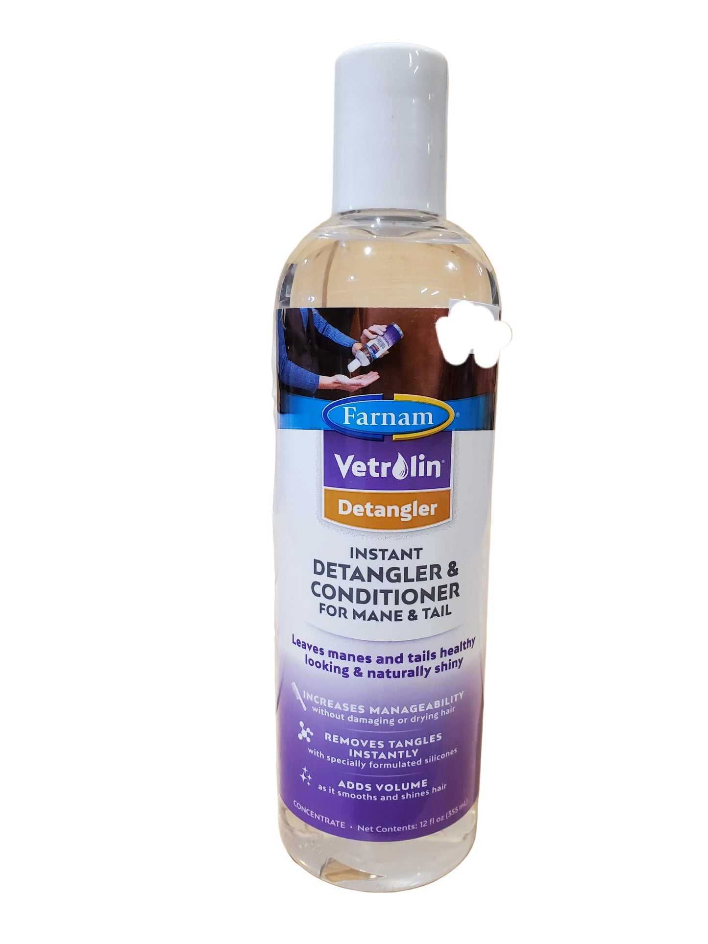 A bottle of Vetrolin Instant Detangler & Conditioner for mane and tail, with a label featuring a horse.