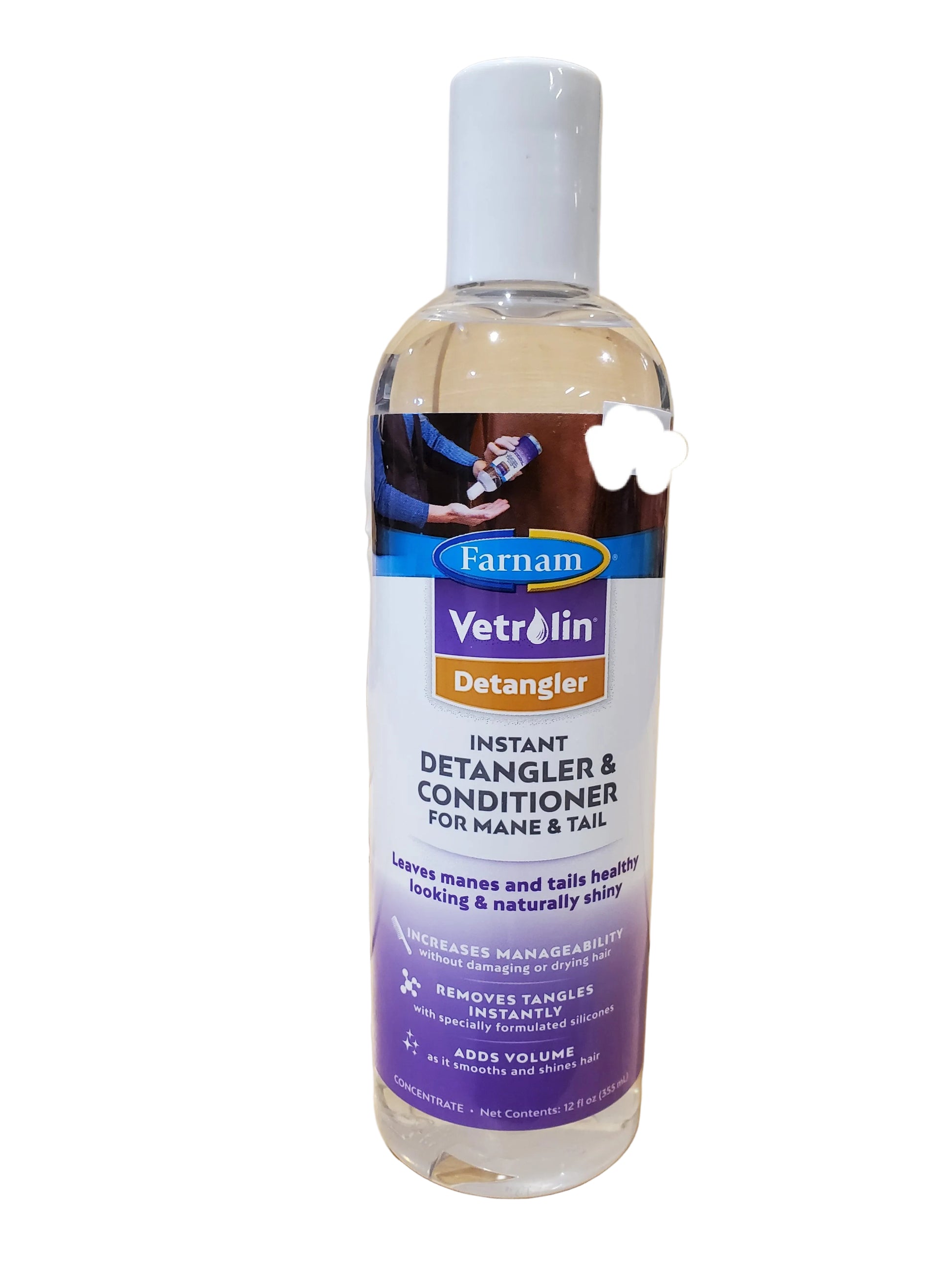 A bottle of Vetrolin Instant Detangler & Conditioner for mane and tail, with a label featuring a horse.