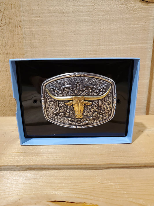 Antique colored belt buckle with a steerhead design, displayed in an open box with a black interior.