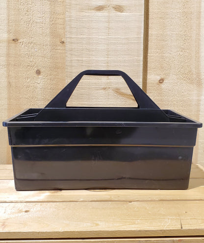 A black plastic utility tote with a handle, designed to be carried by hand and to fit onto a fence board.