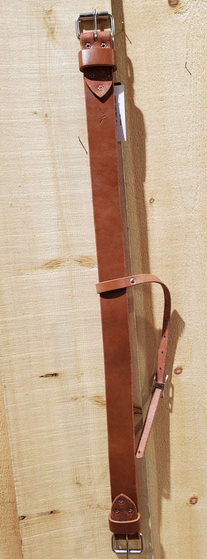 a piece of leather with roller buckles on either end with a strap in the center designed for use on horses to attach to a western saddle