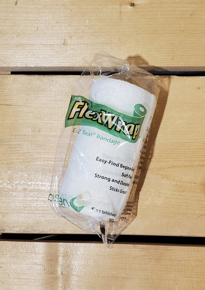 A rolled-up white FlexWrap E-Z Tear bandage, secured with a label that has the product name and details.