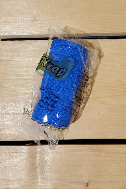 A rolled-up blue FlexWrap E-Z Tear bandage, secured with a label that has the product name and details.