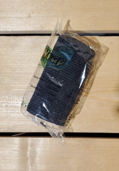 A rolled-up black FlexWrap E-Z Tear bandage, secured with a label that has the product name and details.
