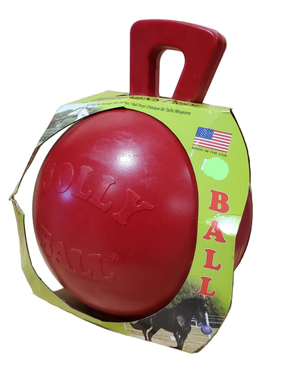 a red jolly ball for horses to play with in a cardboard display box on a white background
