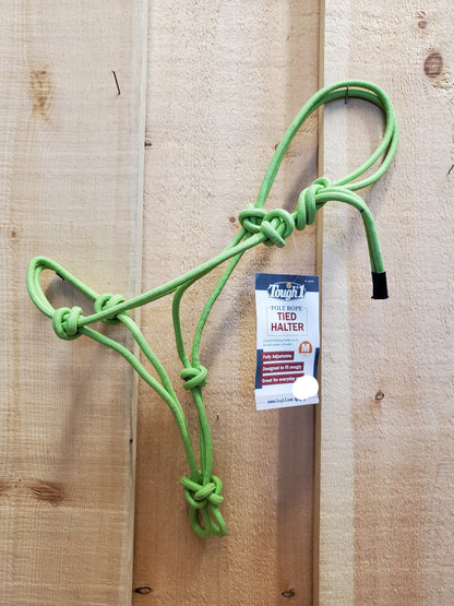 A lime green poly-nylon rope halter hanging against a wooden 